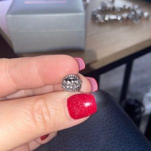 Pandora feather charm has cubic zirconia around the rim